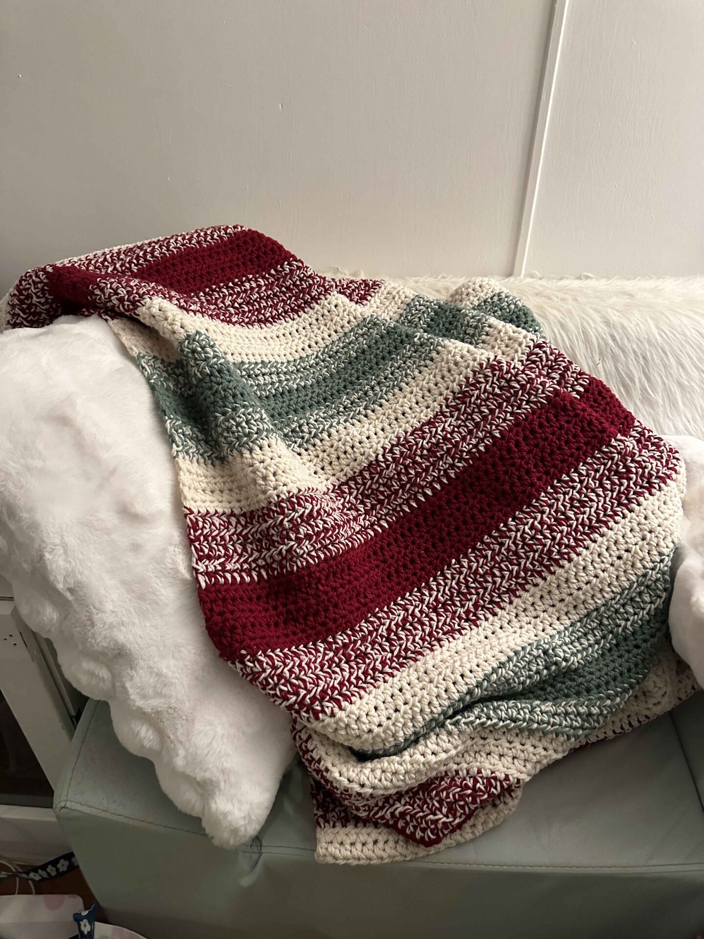 Handcrafted blanket draped over a couch