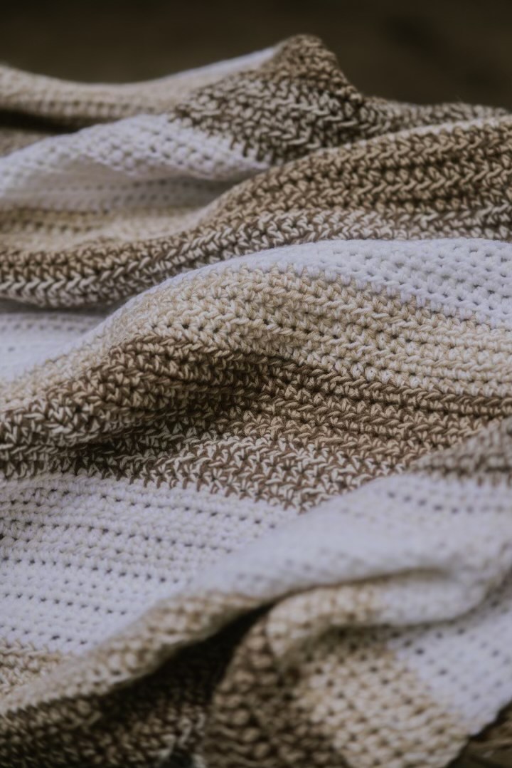Haystack Rock blanket, rich browns and dancing cream
